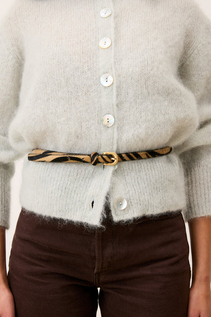 SIGNATURE zebra pony belt worn on a model by Rouje