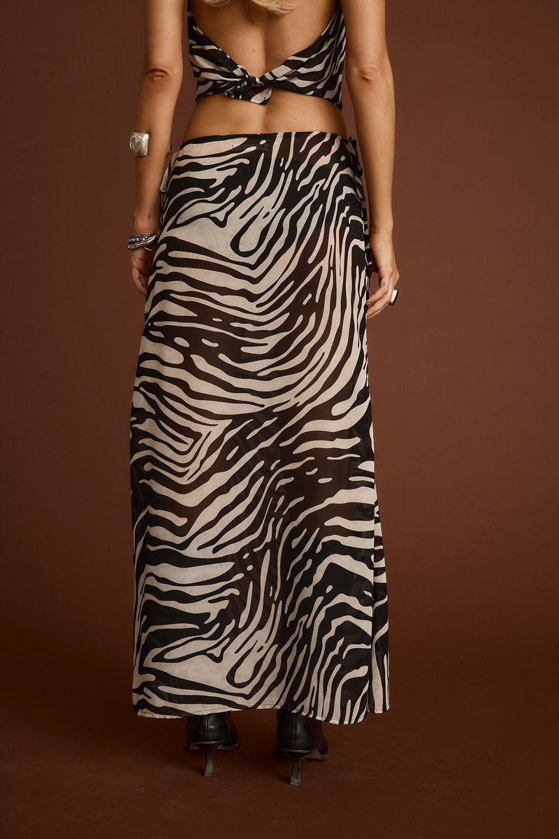 Celia Zebra Maxi Skirt paired with complementary accessories for a polished look.
