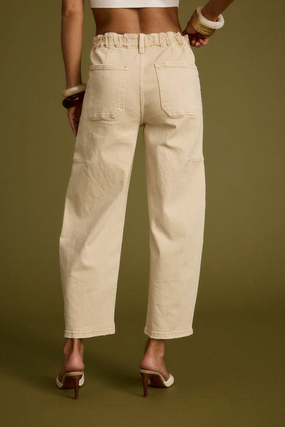 Detail shot of the Chandler Beige Barrel Jeans highlighting the design elements.