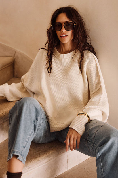 Detail shot of the Chelsea Cream Sweater highlighting the design elements.