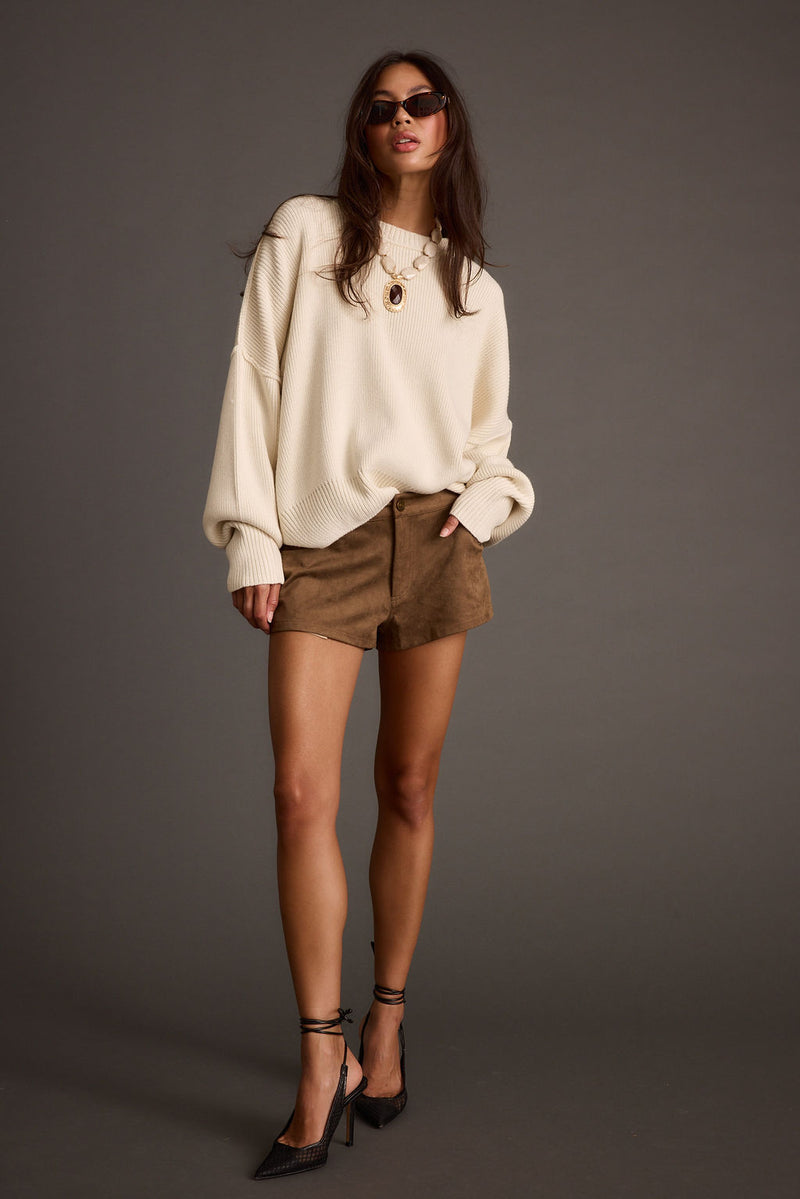 Chelsea Cream Sweater shown in a complementary styling arrangement.