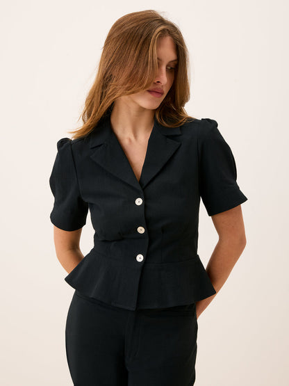ANISA black peplum blouse worn on a model by Rouje