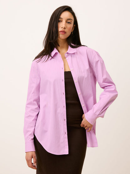 Harper pink striped shirt worn open, front view