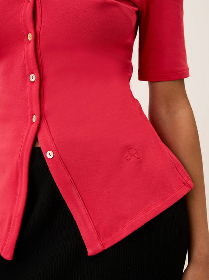 MAELA red V-neck jersey top, detail of embroidered R by Rouje