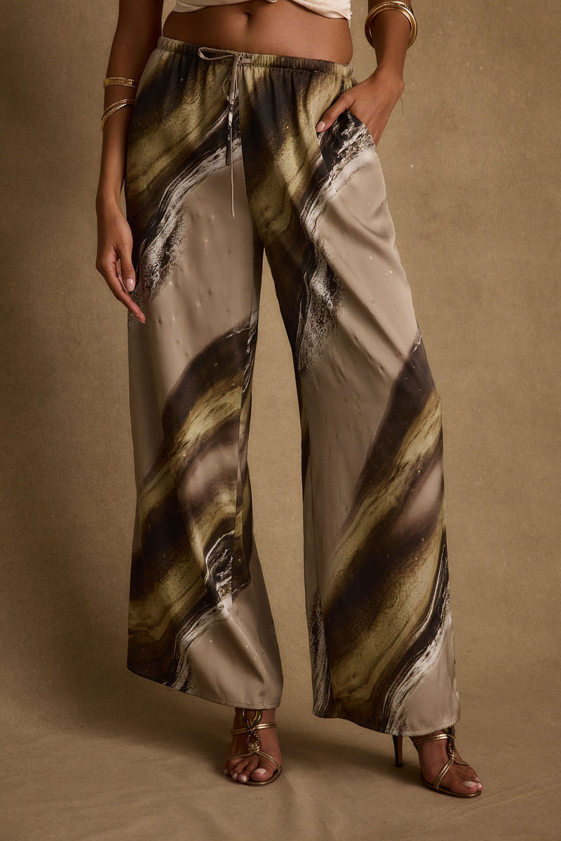 Full-length view of the pants showing the drape and movement.