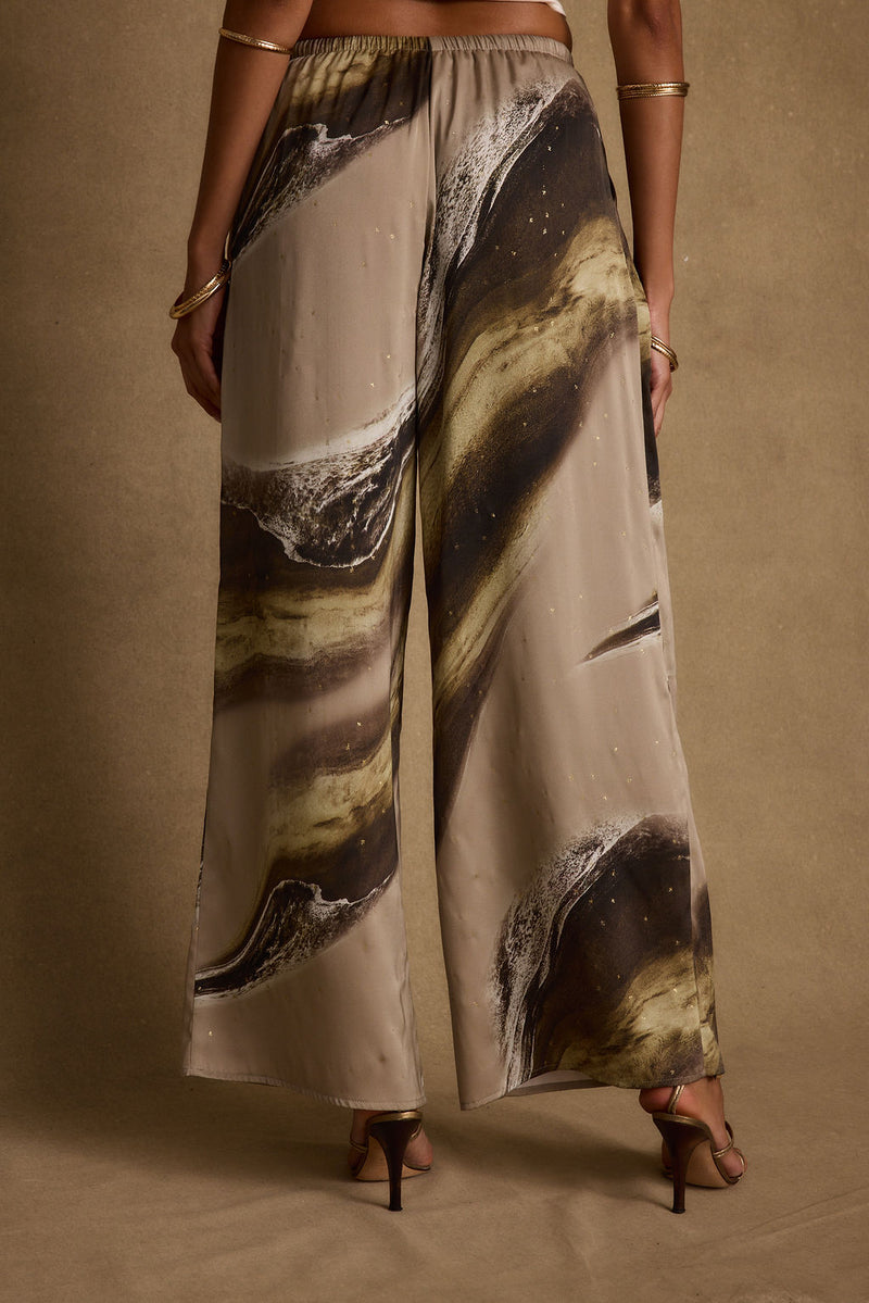 Detail shot of the Clear Breeze Marble Satin Pants highlighting the satin elements.
