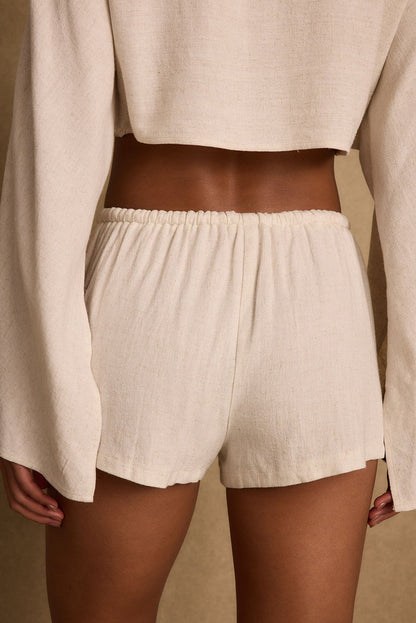 Back view of the linen shorts showing the silhouette and fit.