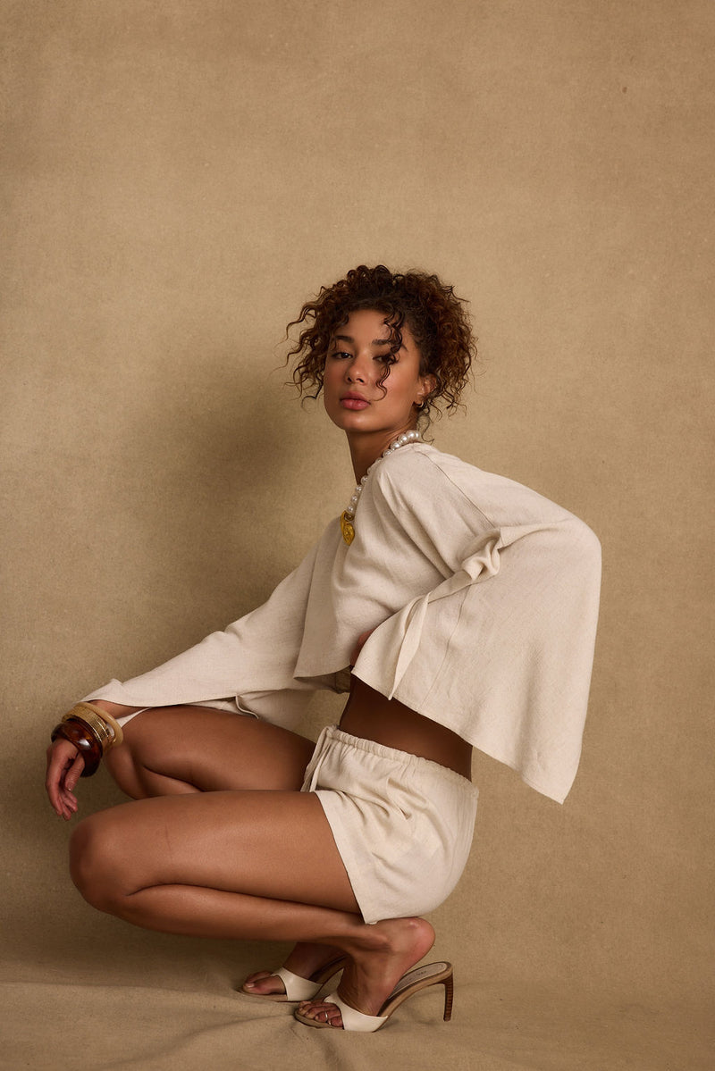 Lifestyle shot of the shorts styled for day-to-night versatility.