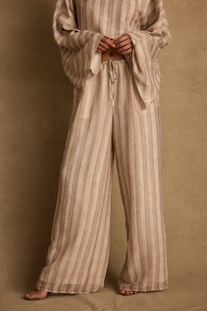 Back view of the striped chiffon pants showing the silhouette and fit.