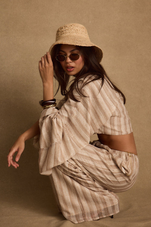 Striped chiffon top with refined detailing and a flattering silhouette.