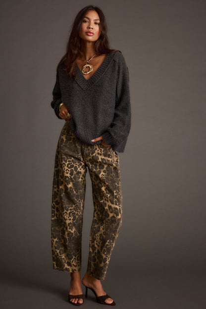 Full-length view of the sweater showing the drape and movement.