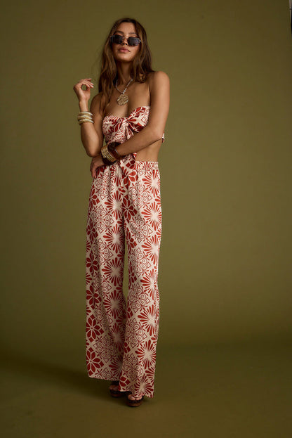 Full-length view of the rust top showing the drape and movement.