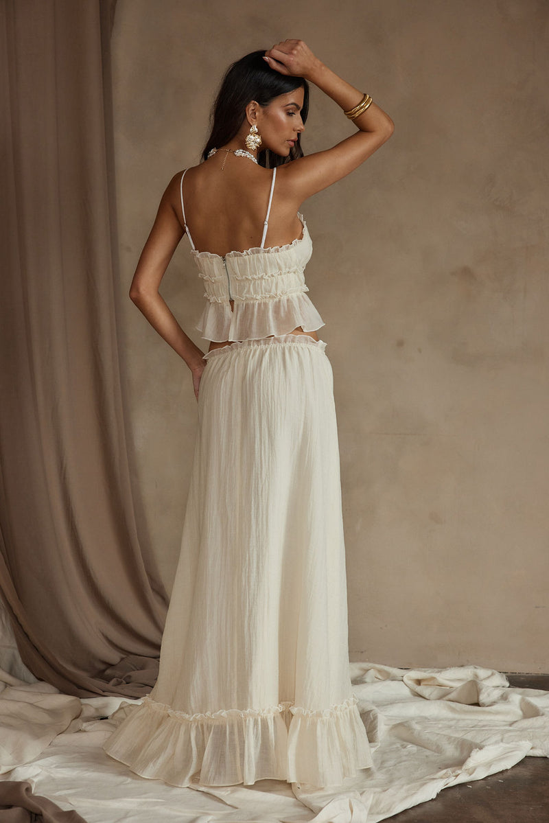 Back view of the yellow maxi skirt showing the silhouette and fit.