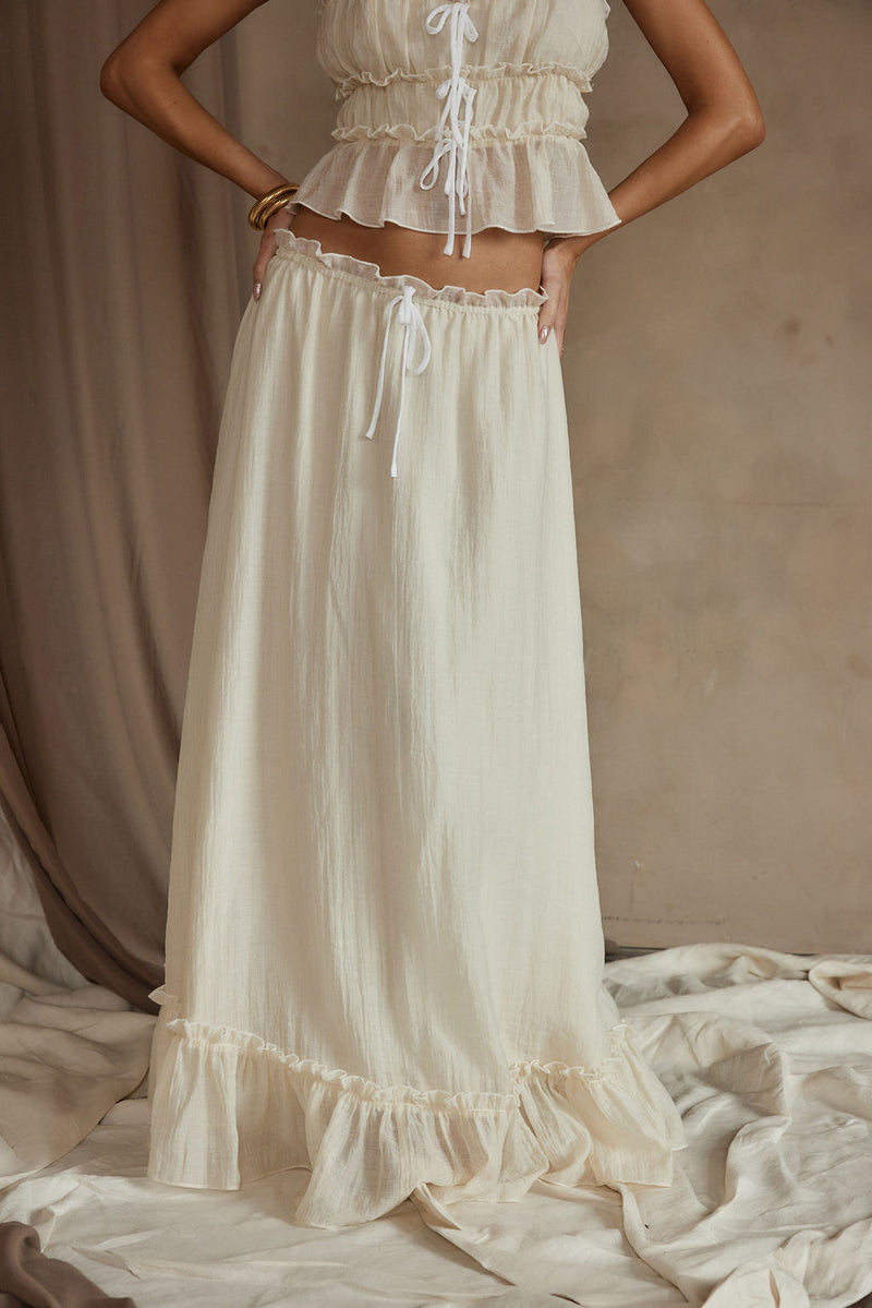 Dahlia Baby Yellow Maxi Skirt paired with complementary accessories for a polished look.