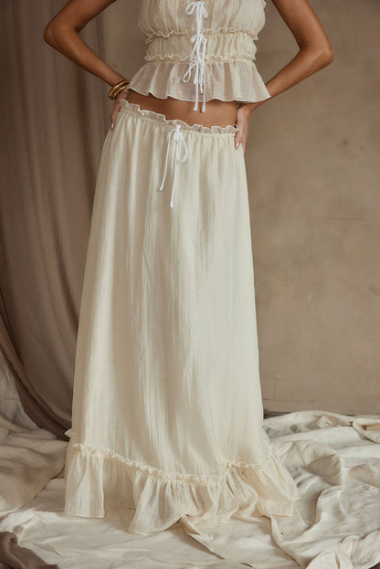 Dahlia Baby Yellow Maxi Skirt paired with complementary accessories for a polished look.
