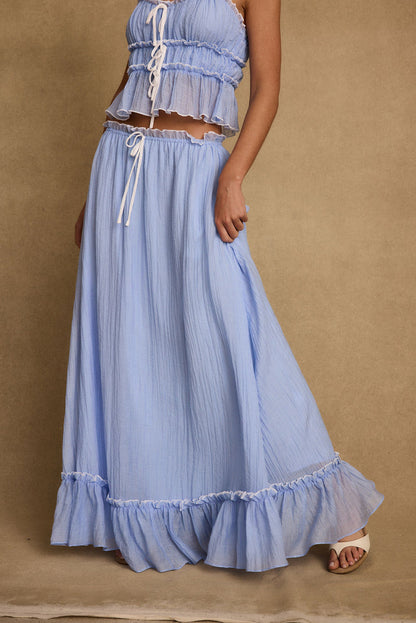 Back view of the blue maxi skirt showing the silhouette and fit.