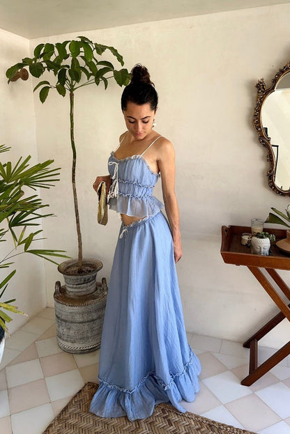 Lifestyle shot of the blue maxi skirt styled for day-to-night versatility.