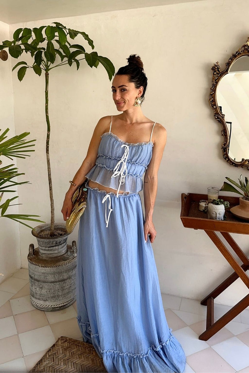 Lifestyle shot of the blue piece styled for day-to-night versatility.