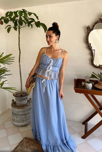 Lifestyle shot of the blue piece styled for day-to-night versatility.