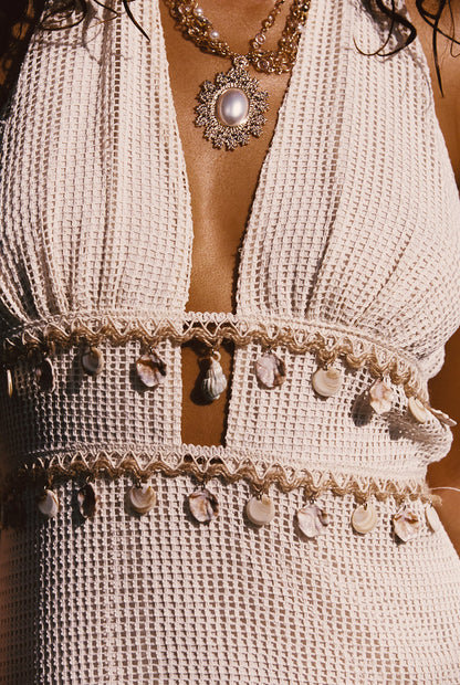 Detail shot of the Divine Ivory Shell Embellished Midi Dress highlighting the design elements.