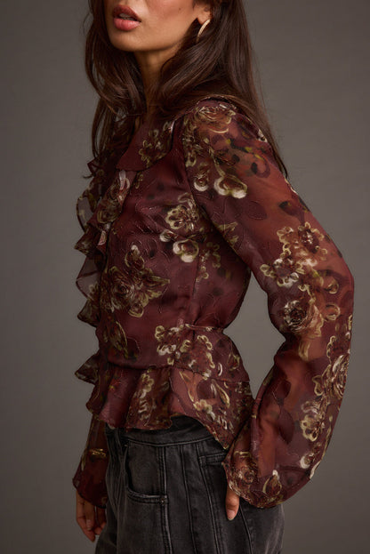 Back view of the plum blouse showing the silhouette and fit.