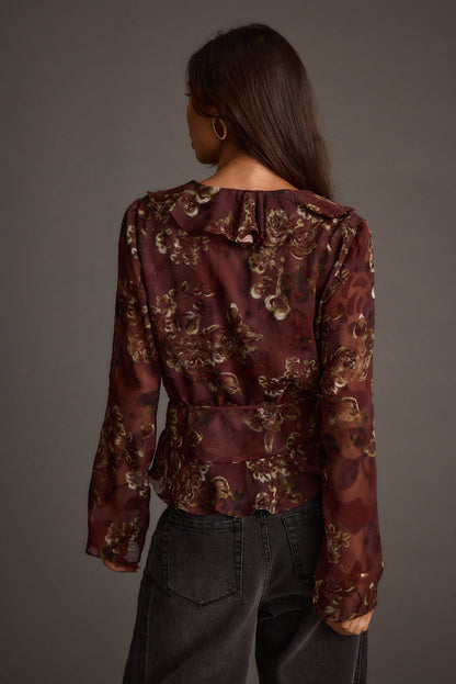 Close-up of the Dominique Plum Floral Blouse showcasing the fabric texture and design details.