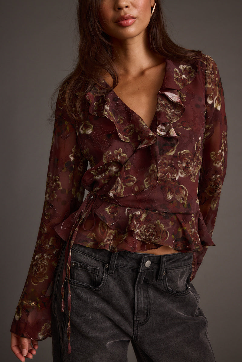 Dominique Plum Floral Blouse paired with complementary accessories for a polished look.