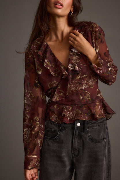 Detail shot of the Dominique Plum Floral Blouse highlighting the design elements.