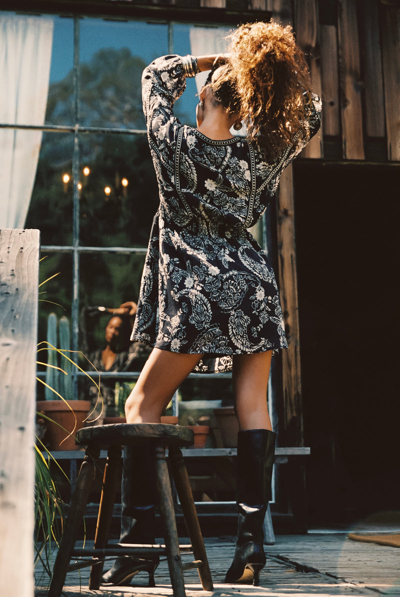 Close-up of the Donna Black And White Floral Mini Dress showcasing the fabric texture and design details.