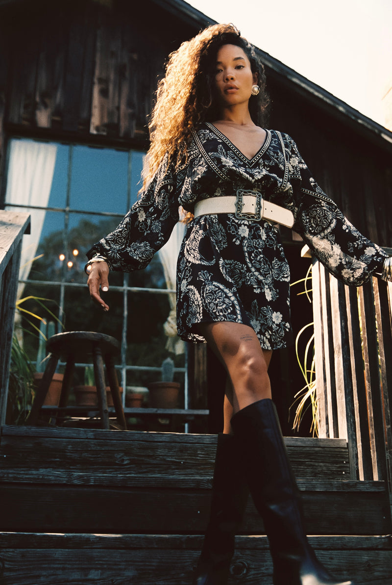 Donna Black And White Floral Mini Dress styled in a complete look from an alternate angle.