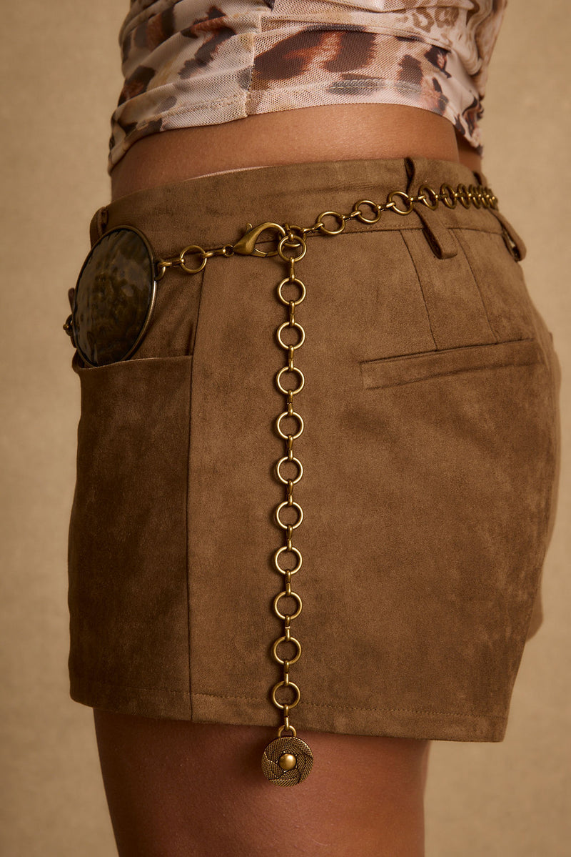 Dune Coin Statement Belt paired with complementary accessories for a polished look.