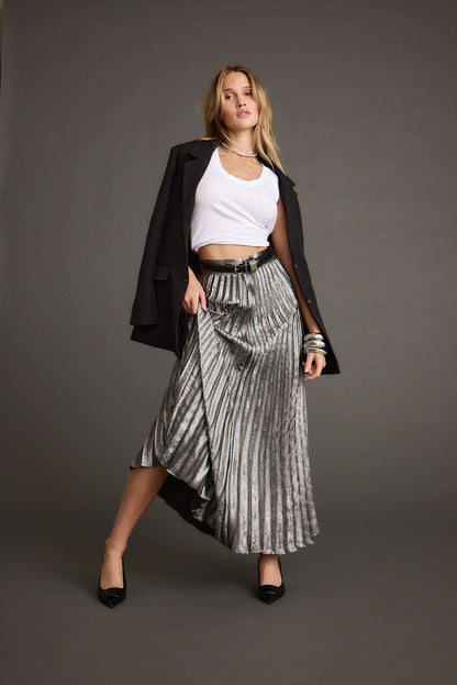 Lifestyle shot of the metallic maxi skirt styled for day-to-night versatility.