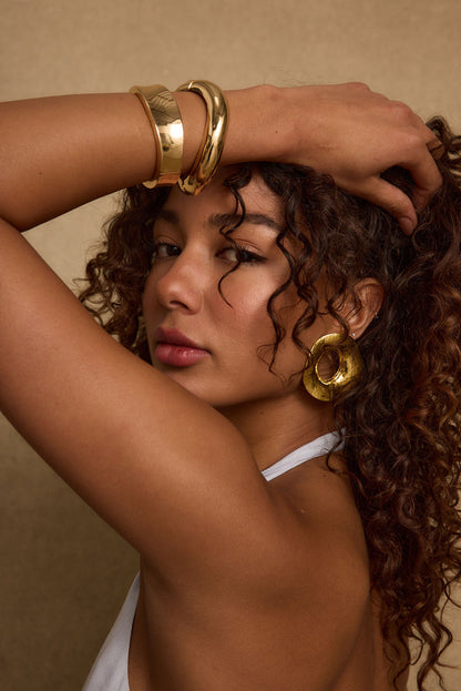Gold piece with refined detailing and a flattering silhouette.