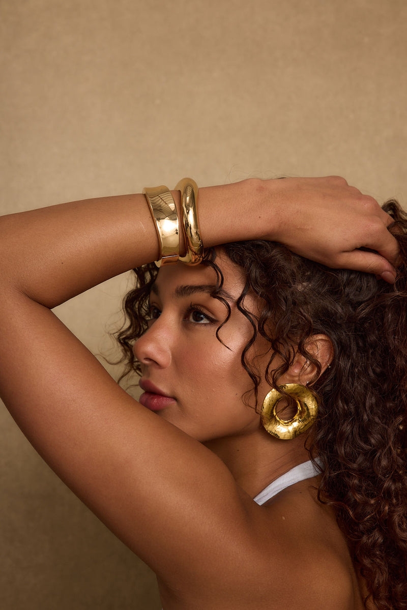Elisa Gold Bangle Set paired with complementary accessories for a polished look.