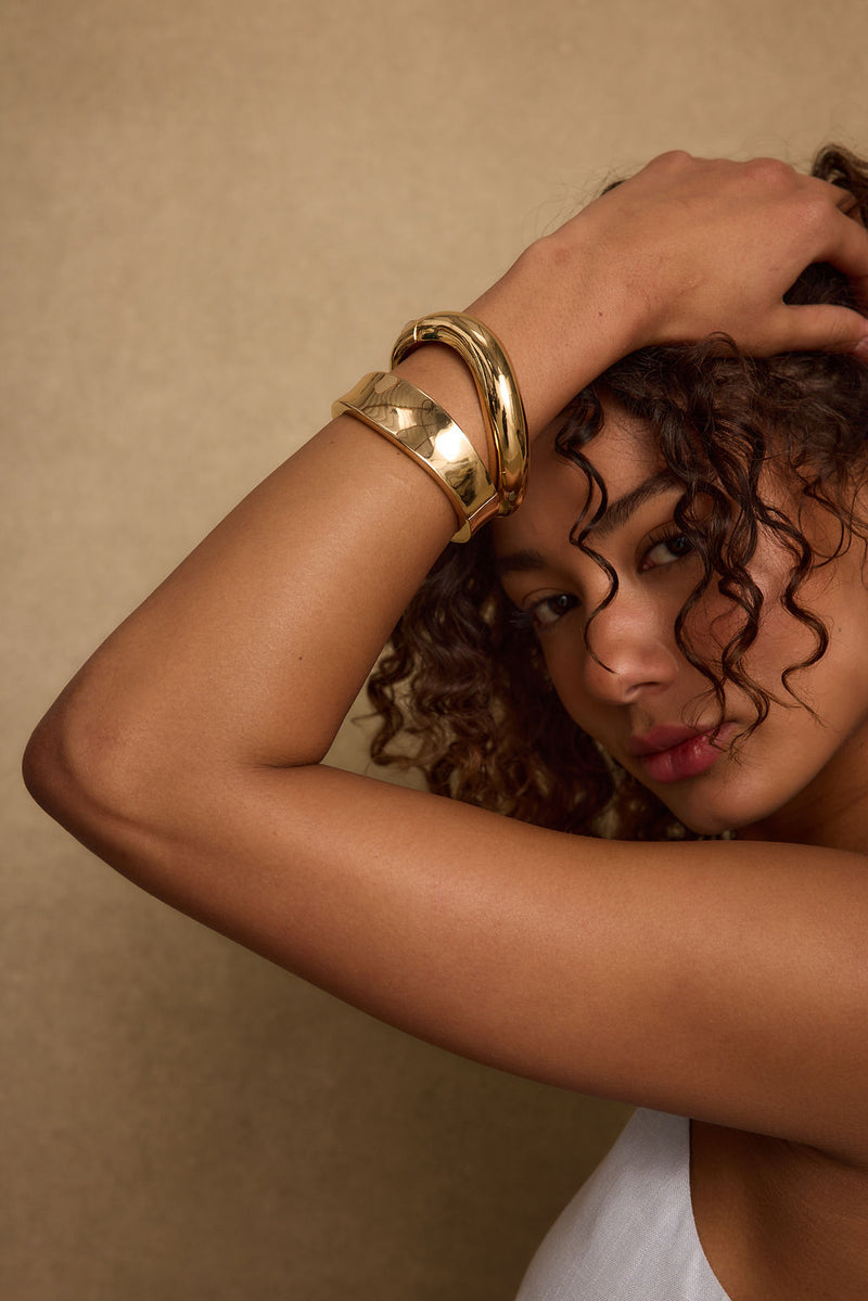 Detail shot of the Elisa Gold Bangle Set highlighting the design elements.