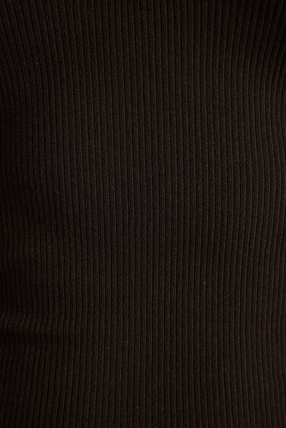 Close-up of black stretch ribbed knit fabric texture on the Emily halter top.