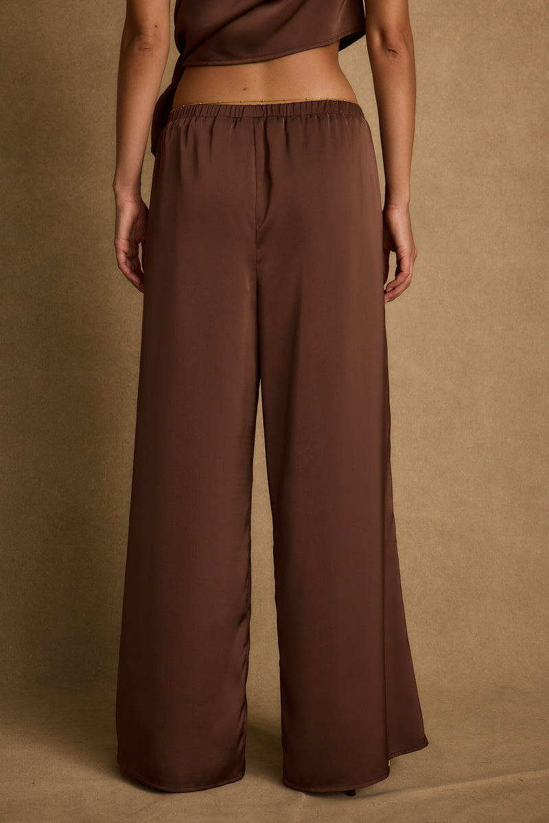 Estelle Espresso Satin Pant paired with complementary accessories for a polished look.