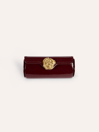 LIPS burgundy lipstick case with rose snap, front view by Rouje