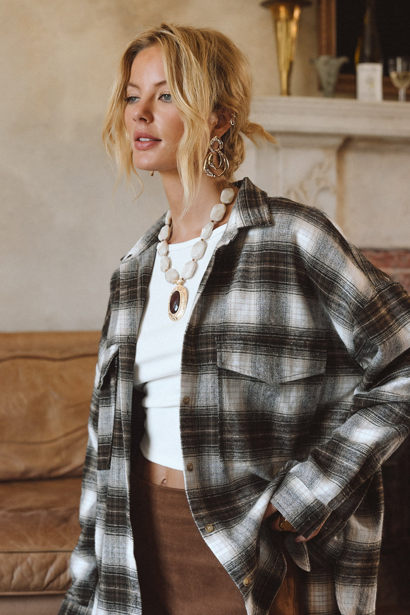 Espresso piece with refined detailing and a flattering silhouette.