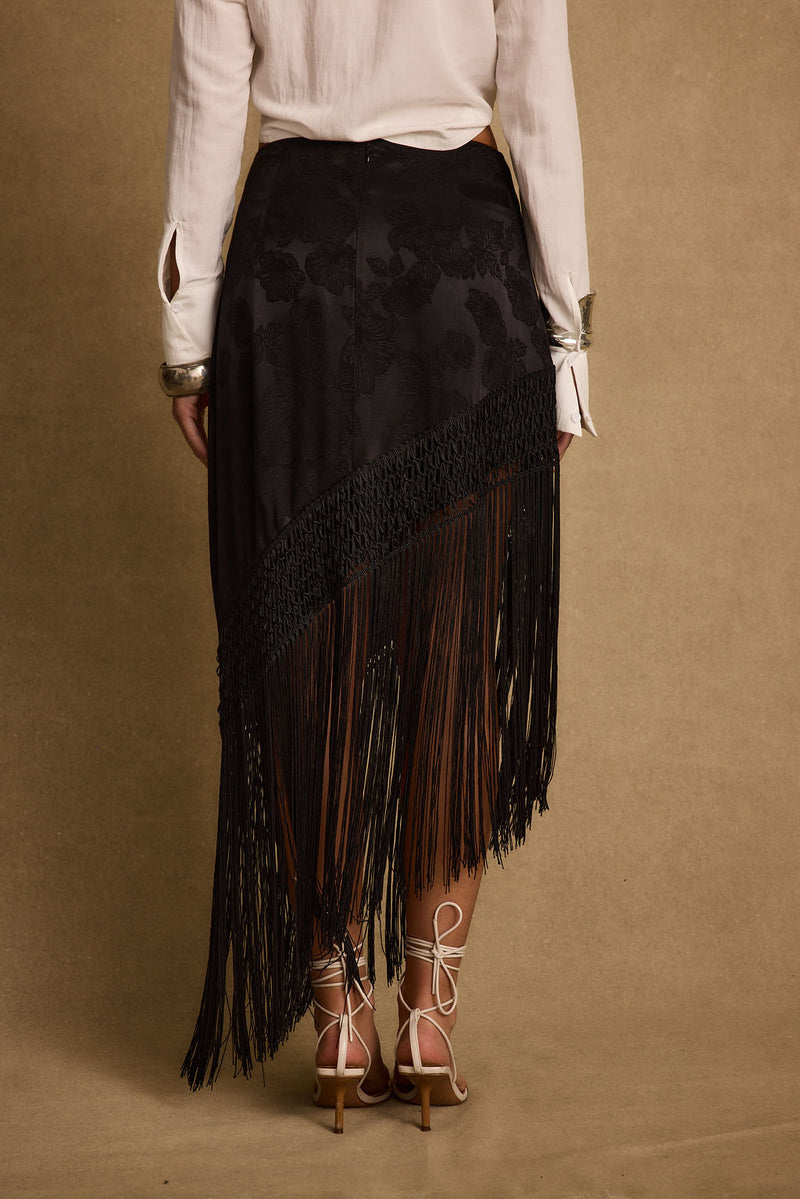 Close-up of the Frankie Black Satin Jacquard Fringe Midi Skirt showcasing the fringe texture and craftsmanship.