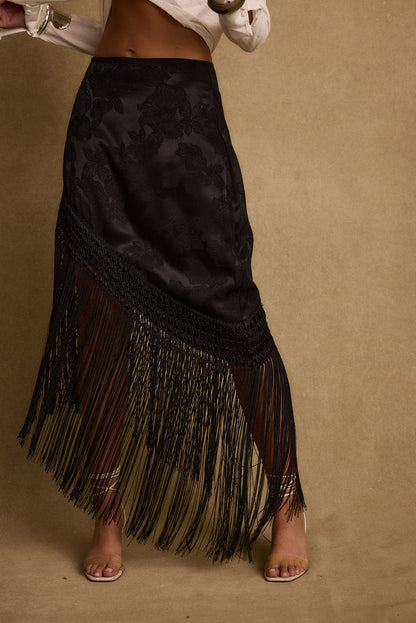 Detail shot of the Frankie Black Satin Jacquard Fringe Midi Skirt highlighting the fringe and satin elements.
