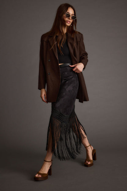 Alternate angle of the black midi skirt highlighting the overall design.