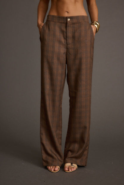 Tan pants with refined detailing and a flattering silhouette.