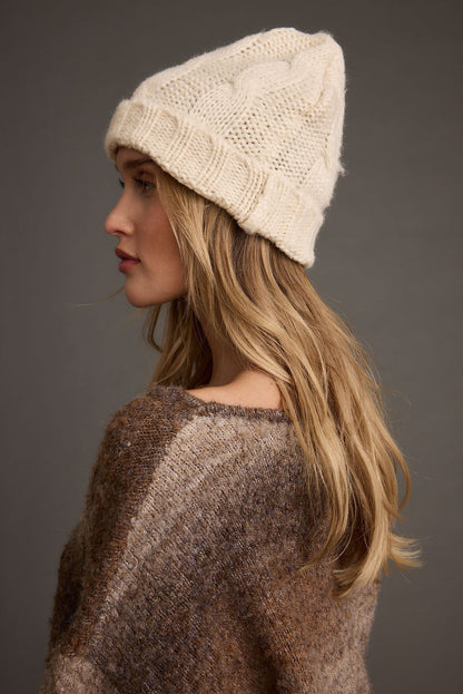 Close-up of the Frost Cream Knit Beanie showcasing the knit texture and craftsmanship.