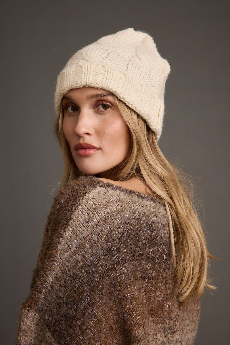 Frost Cream Knit Beanie styled in a complete look from an alternate angle.