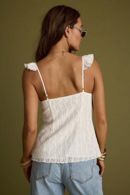 Back view of the white lace top showing the silhouette and fit.