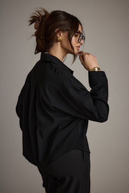 Detail shot of the Gisele Black Poplin Button Down highlighting the design elements.
