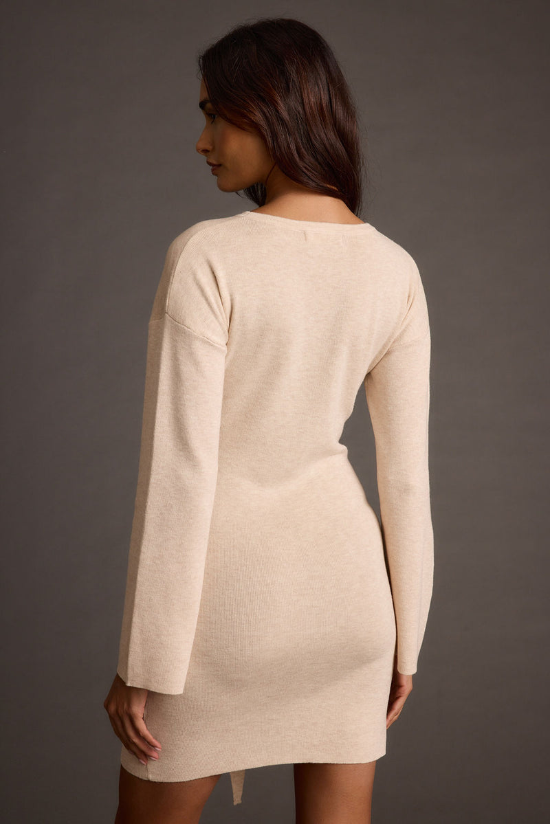 Detail shot of the Grayden Cream Belted Mini Dress highlighting the design elements.
