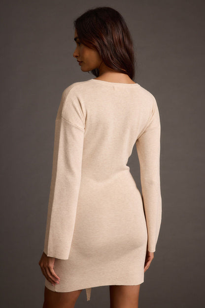 Detail shot of the Grayden Cream Belted Mini Dress highlighting the design elements.