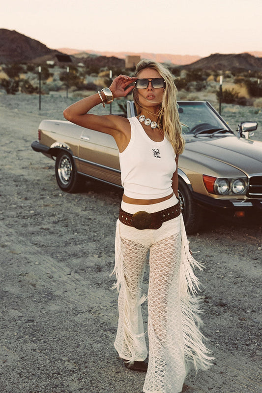 Cream fringe pants with refined accents, a cream satin pants standout.